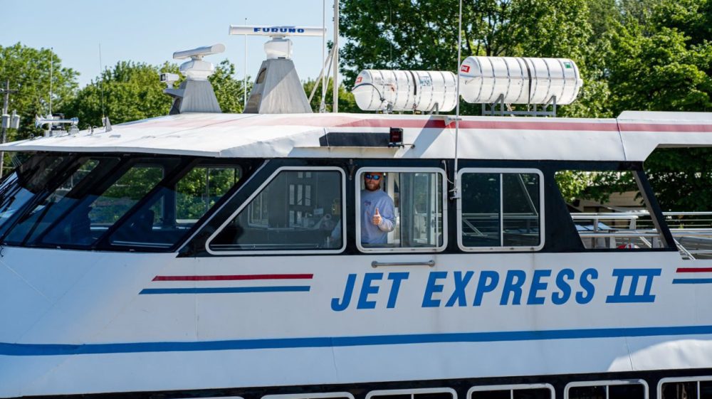 a passenger bus that is parked on the side of a road