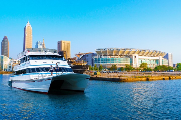 a small boat in a harbor next to a body of water