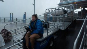 a person sitting at a dock