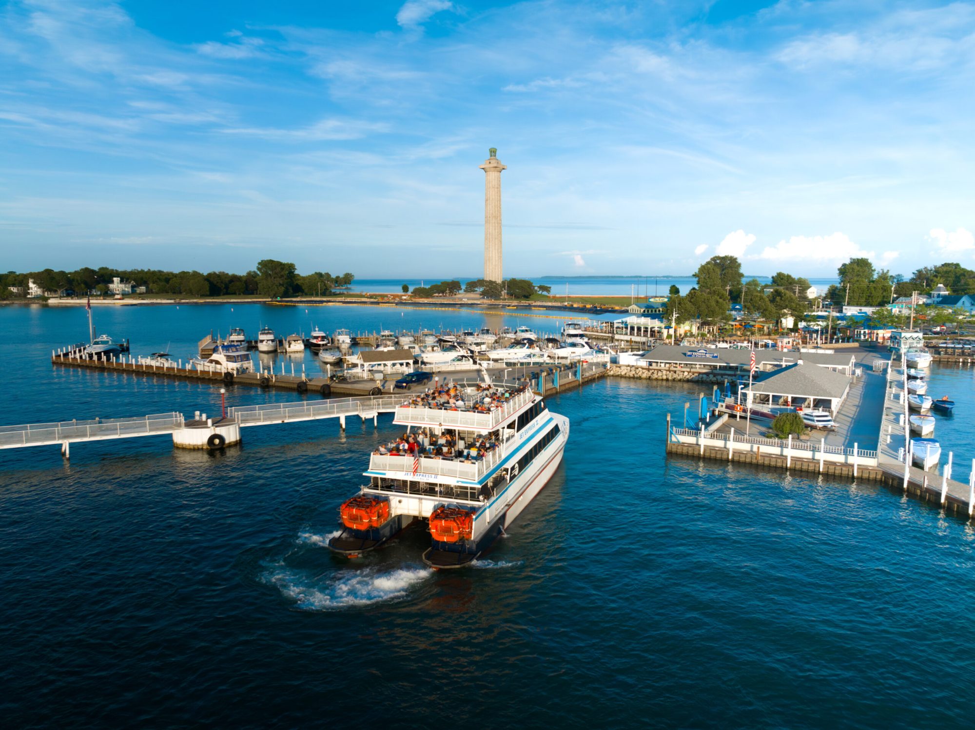 a small boat in a harbor next to a body of water
