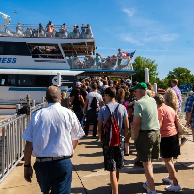 a group of people walking in front of a crowd
