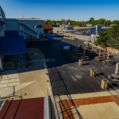 a group of people sitting at a dock