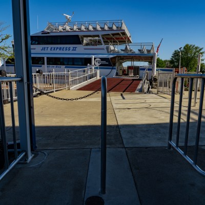 a chair sitting in front of a fence