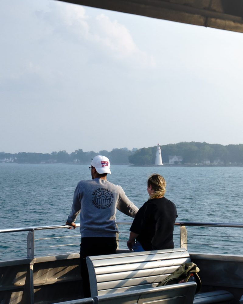 a man sitting in a boat on a body of water