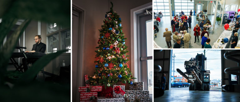 a group of people sitting at a desk in front of a building