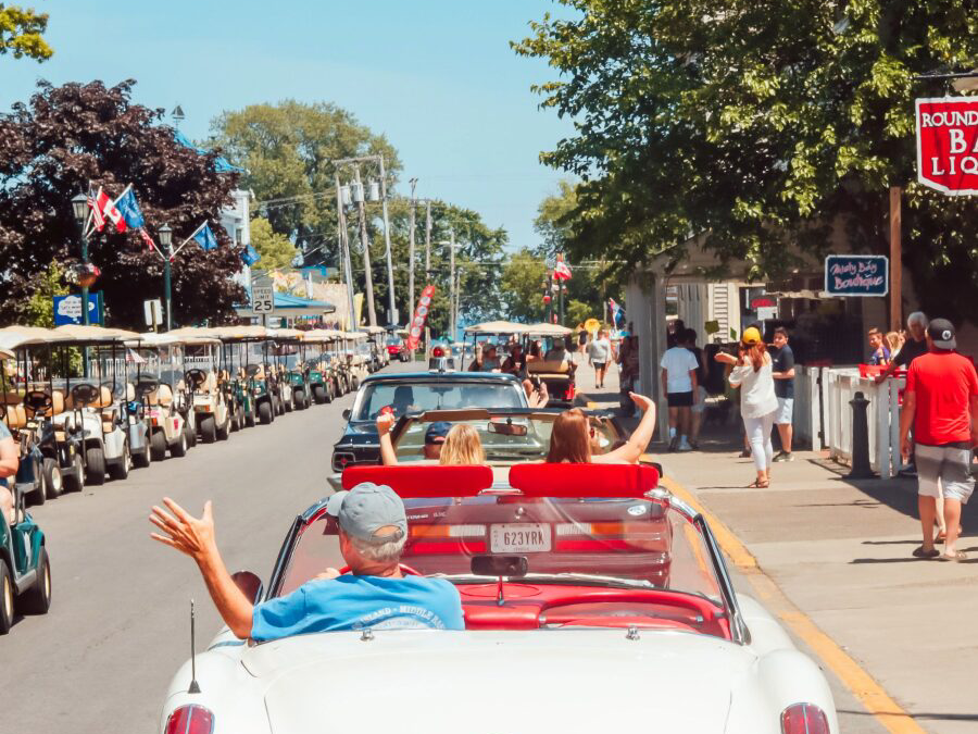 a group of people riding on the back of a car